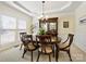 Dining room with a round wood table, six chairs, and elegant lighting fixture at 5059 Saint Clair St, Fort Mill, SC 29715