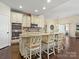 Kitchen with a large island, stainless appliances, and hardwood floors at 5059 Saint Clair St, Fort Mill, SC 29715