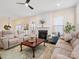 Comfortable living room with fireplace, neutral color palette, and an open layout for easy entertaining at 5059 Saint Clair St, Fort Mill, SC 29715