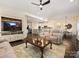 Spacious living room showcasing an open floor plan connecting to the kitchen and dining areas at 5059 Saint Clair St, Fort Mill, SC 29715