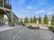 Stone patio featuring a cozy fire pit, perfect for outdoor gatherings and enjoying the serene backyard at 5059 Saint Clair St, Fort Mill, SC 29715