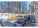 Cozy backyard with patio seating, a small playhouse, and a well-maintained white fence at 5616 Ebley Ln, Charlotte, NC 28227