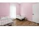 Bright and airy bedroom with hardwood floors and ample natural light at 5616 Ebley Ln, Charlotte, NC 28227