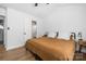 Airy bedroom with a bed, vaulted ceiling, fan, and natural light from a side window at 5616 Ebley Ln, Charlotte, NC 28227