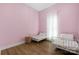 Bright and airy bedroom with hardwood floors and ample natural light at 5616 Ebley Ln, Charlotte, NC 28227