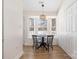 Cozy dining area with natural light and wood flooring, adjacent to the kitchen at 5616 Ebley Ln, Charlotte, NC 28227