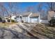 Well-maintained single-story home with an attached garage and a tidy lawn at 5616 Ebley Ln, Charlotte, NC 28227