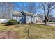 Charming home showcasing a manicured lawn, a tidy yard, and a traditional design at 5616 Ebley Ln, Charlotte, NC 28227