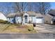 Charming single-story home with a manicured lawn and attached garage at 5616 Ebley Ln, Charlotte, NC 28227