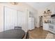 The Kitchen features white cabinets, stainless steel appliances, and open shelving at 5616 Ebley Ln, Charlotte, NC 28227