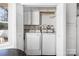 Convenient laundry room boasts washer, dryer, storage cabinets, and natural light at 5616 Ebley Ln, Charlotte, NC 28227