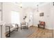Bright living room area with modern decor and wood flooring at 5616 Ebley Ln, Charlotte, NC 28227
