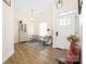 Sun-drenched living room with modern decor, wood flooring, and a welcoming atmosphere at 5616 Ebley Ln, Charlotte, NC 28227