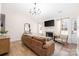 Cozy living room with fireplace, vaulted ceiling, and hardwood floors at 5616 Ebley Ln, Charlotte, NC 28227