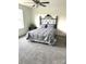 Comfortable bedroom featuring an ornate headboard, plush bedding, and soft natural light at 565 Perry Rd, Troutman, NC 28166