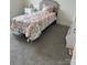 Cozy bedroom with soft carpeting, a comfortable bed, and neutral decor at 565 Perry Rd, Troutman, NC 28166