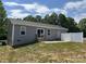 Home with sliding glass door and privacy fence, perfect for outdoor relaxation at 565 Perry Rd, Troutman, NC 28166