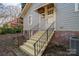 Back entrance featuring updated steps and a metal railing at 634 Carolina Ave, Gastonia, NC 28052