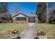 Charming single-story home with a welcoming front porch and a beautifully landscaped yard at 634 Carolina Ave, Gastonia, NC 28052