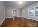 Open-concept living room featuring hardwood floors, neutral walls, and bright natural light at 634 Carolina Ave, Gastonia, NC 28052