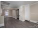 Spacious living room showcasing light tan walls, two entryways and a built-in storage unit at 634 Carolina Ave, Gastonia, NC 28052