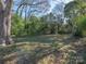 Secluded backyard with mature trees offering plenty of shade at 707 Oakshade Ave, Kannapolis, NC 28083
