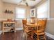 Cozy dining room with a round table and classic wood chairs, creating a warm atmosphere at 707 Oakshade Ave, Kannapolis, NC 28083