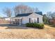 Charming one-story home with a screened-in porch, neat landscaping, and a classic design at 707 Oakshade Ave, Kannapolis, NC 28083