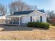 Charming one-story home with a screened-in porch, neat landscaping, and a classic design at 707 Oakshade Ave, Kannapolis, NC 28083