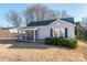 Charming one-story home with a screened-in porch, neat landscaping, and a classic design at 707 Oakshade Ave, Kannapolis, NC 28083