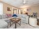 Comfortable living room with a large sectional sofa, stylish decor, and access to other rooms at 707 Oakshade Ave, Kannapolis, NC 28083