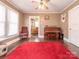 Inviting room with hardwood floors, a ceiling fan, and view into the dining area for easy entertaining at 707 Oakshade Ave, Kannapolis, NC 28083
