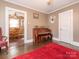 Charming living room features hardwood floors and an open view into the dining area, perfect for entertaining guests at 707 Oakshade Ave, Kannapolis, NC 28083