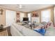 Cozy living room with a fireplace, hardwood floors, and a comfortable sectional sofa at 707 Oakshade Ave, Kannapolis, NC 28083