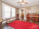 Inviting living room with natural light, ceiling fan, hardwood floors, and a glimpse into the dining area at 707 Oakshade Ave, Kannapolis, NC 28083