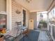 Inviting screened porch featuring cozy seating, a charming welcome mat, and exterior views at 707 Oakshade Ave, Kannapolis, NC 28083