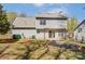 Backyard featuring a cozy patio, a fire pit, mature trees, and lush grass at 7815 Ambleside Dr, Charlotte, NC 28216
