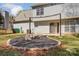 Picture of cozy backyard fire pit with stone border and well-maintained surroundings with home at 7815 Ambleside Dr, Charlotte, NC 28216