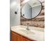 Stylish half bathroom features wood accent wall, vessel sink, and modern fixtures at 7815 Ambleside Dr, Charlotte, NC 28216