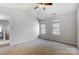 Large bedroom filled with natural light showcasing plush carpet and neutral walls at 7815 Ambleside Dr, Charlotte, NC 28216