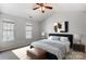 Cozy bedroom features a vaulted ceiling, ample natural light, and comfortable furnishings at 7815 Ambleside Dr, Charlotte, NC 28216