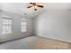 Spacious bedroom with vaulted ceilings and bright windows, presenting a blank canvas for personalization at 7815 Ambleside Dr, Charlotte, NC 28216