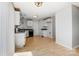 Open-concept kitchen adjacent to a spacious room, featuring modern appliances and ample storage at 7815 Ambleside Dr, Charlotte, NC 28216