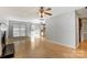 Bright living room boasts a fireplace, wood floors, with a slider leading to the back yard at 7815 Ambleside Dr, Charlotte, NC 28216