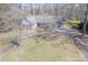 Expansive aerial view showcasing the home's layout, surrounded by lush greenery and a sprawling driveway at 10101 Woodview Cir, Charlotte, NC 28277