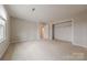 Bedroom featuring neutral carpeting, a window, and closet space at 10101 Woodview Cir, Charlotte, NC 28277