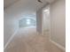 Finished attic space with neutral carpet, freshly painted walls and natural light at 10101 Woodview Cir, Charlotte, NC 28277