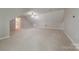 Large bonus room with neutral carpet and ceiling fan offering versatile space at 10101 Woodview Cir, Charlotte, NC 28277