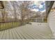 Spacious deck with gray stain and outdoor seating area at 10101 Woodview Cir, Charlotte, NC 28277