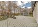 Spacious deck with gray stain and outdoor seating area at 10101 Woodview Cir, Charlotte, NC 28277